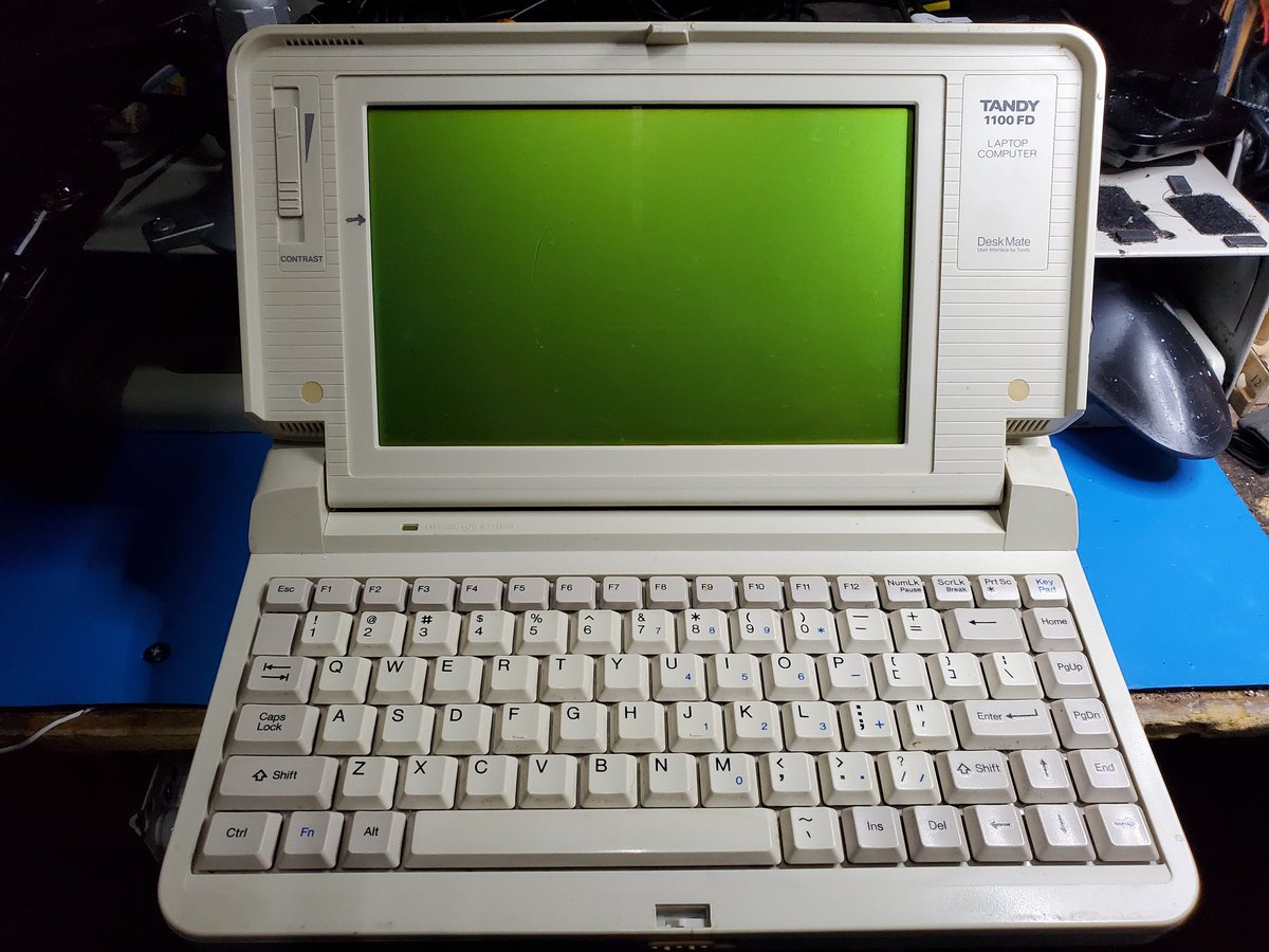 Front view of the Tandy 1100FD with the old-timey monochrome liquid crystal display upright and visible.